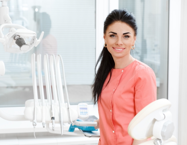 Smiling woman talking to dentist