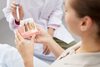 patient discussing dental implants