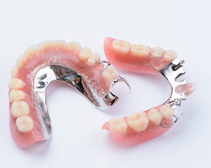 Two partial dentures on a white background