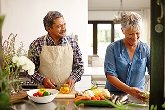 older couple preparing food
